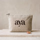 Linen toiletry bag with the embroidered aya mark