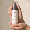 The Aya Sixty — Salvia facial cream in hand, 50 ml pump bottle