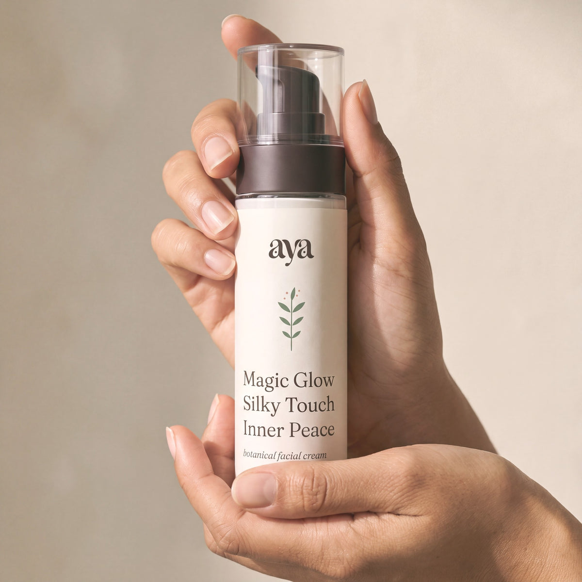 The Aya Sixty — Salvia facial cream in hand, 50 ml pump bottle